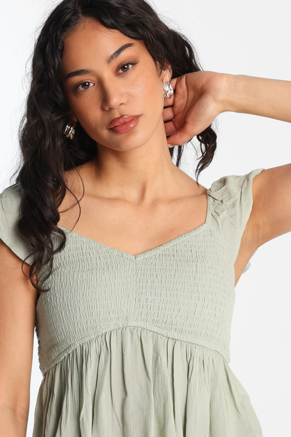 Haut babydoll smocké à manches volantées Haut babydoll smocké à manches volantées