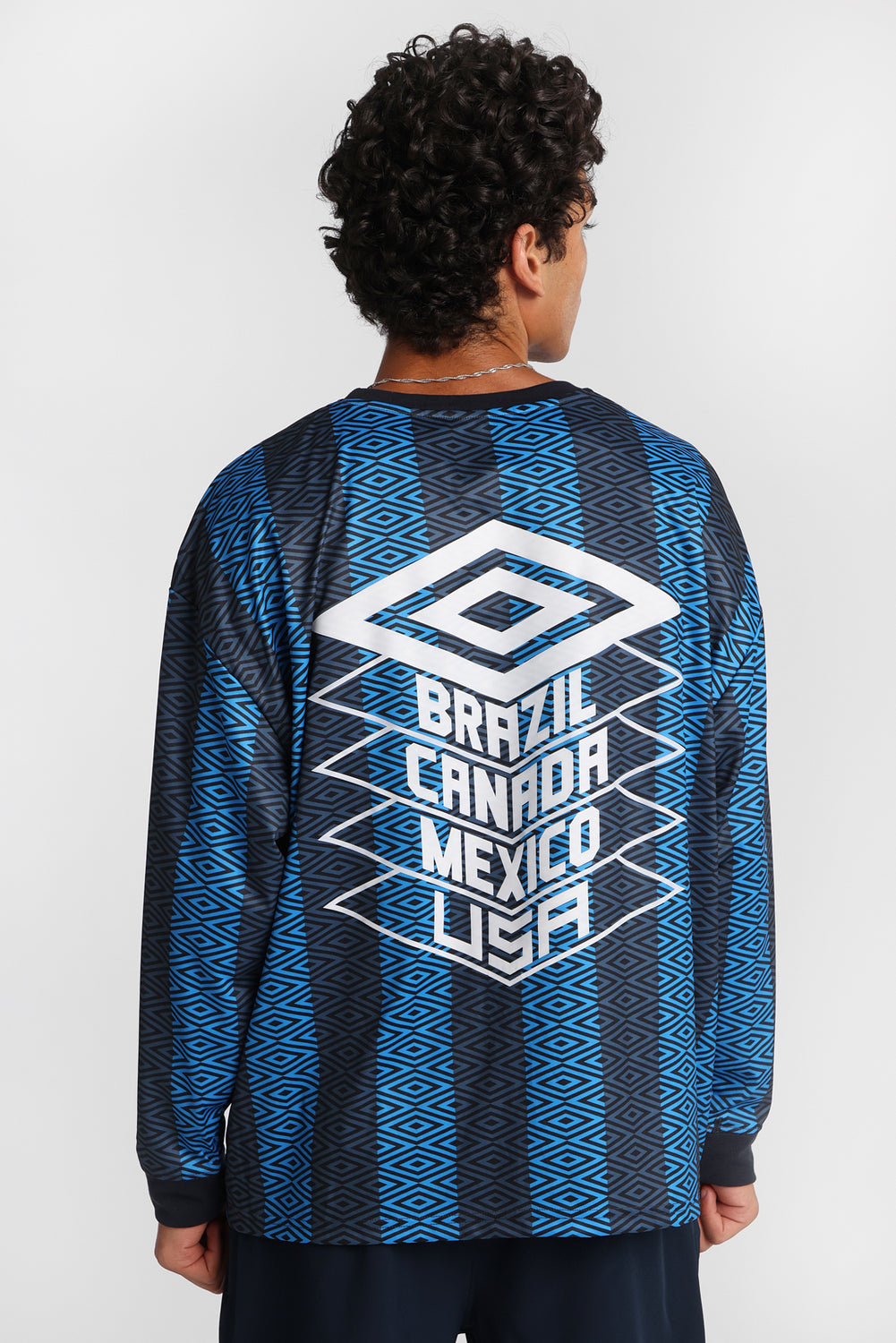 Maillot à manches longues col ras du cou Umbro World's Game Maillot à manches longues col ras du cou Umbro World's Game