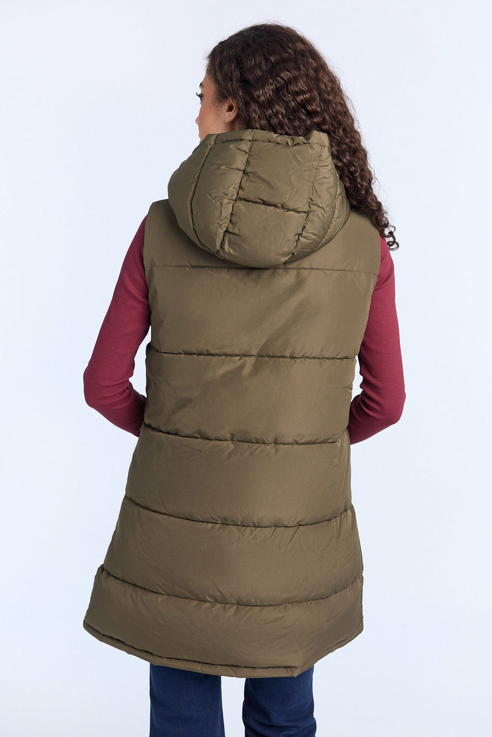 Gilet matelassée longue à capuche Gilet matelassée longue à capuche
