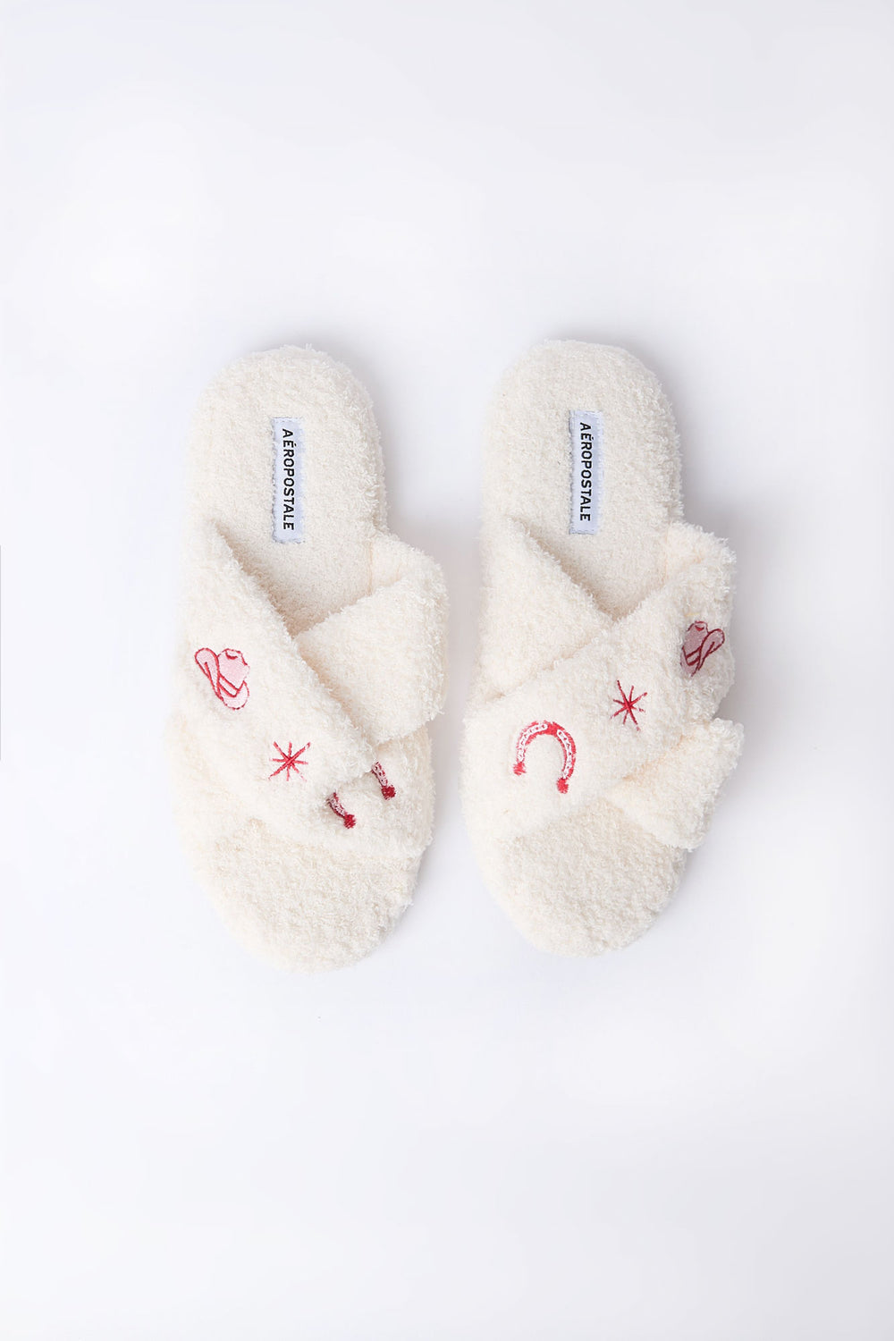 Pantoufles en bouclée pelucheuse croisées avec broderie Pantoufles en bouclée pelucheuse croisées avec broderie